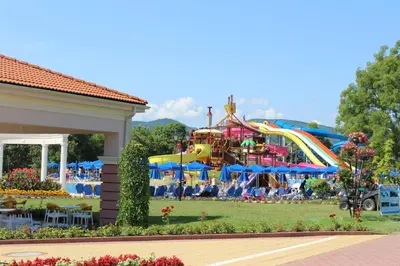 a roller coaster at a carnival in a park at Duni Holiday Village - All Inclusive in Sozopol