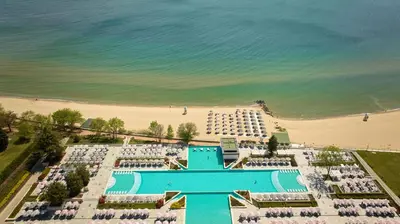 an aerial view of a resort with a pool and a beach at Secrets Sunny Beach Resort and Spa - Premium All Inclusive - Adults Only in Sunny Beach