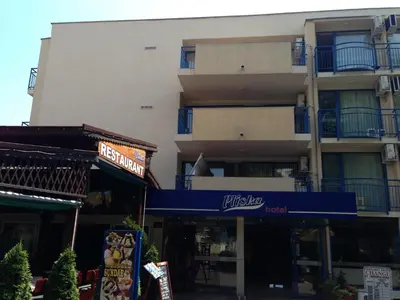 a building with a blue awning in front of it at Hotel Pliska - All Inclusive Light in Sunny Beach