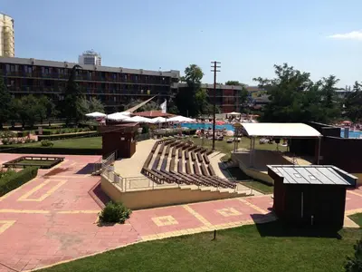 a park with a group of chairs and umbrellas at Hotel Pliska - All Inclusive Light in Sunny Beach