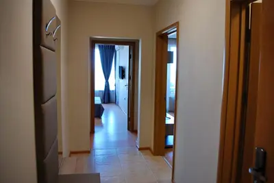 a hallway with a door leading to a room at Dune Boutique Pomorie in Pomorie