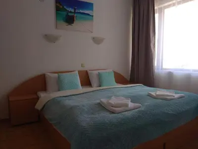 a bedroom with a bed with two towels on it at Vista Del Mar Ap 22 in Ravda