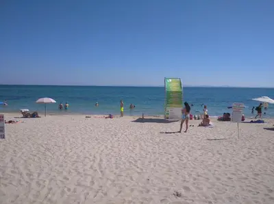 a group of people on a beach with the ocean at Vista Del Mar Ap 22 in Ravda