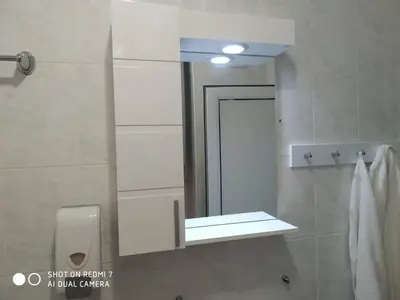 a bathroom with a mirror and a sink at Blue Marine Ap 26 in Ravda