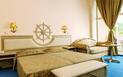 a bedroom with a large bed and a large window at Royal Park Hotel - All Inclusive in Elenite
