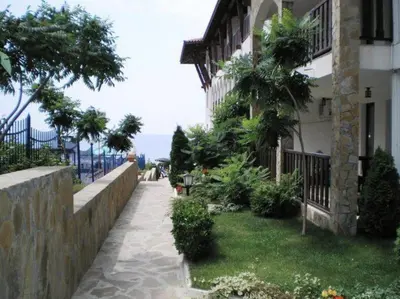 a house with a walkway next to a building at Комплекс «ТОП» in Sveti Vlas