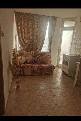 a bedroom with a bed in a room with a window at Apartment Blue Komfort in Sunny Beach