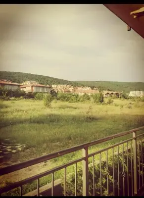 a view from a balcony of a field with houses at Apartment Blue Komfort in Sunny Beach