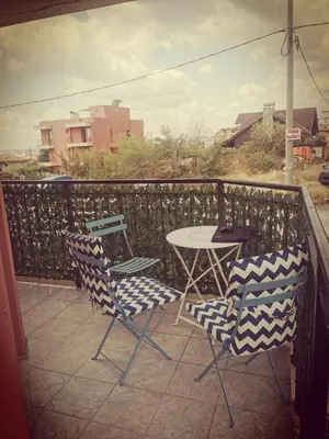 a patio with two chairs and a table on a balcony at Apartment Blue Komfort in Sunny Beach