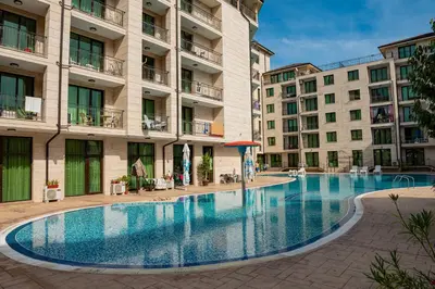 a swimming pool in the middle of a building at Amadeus Lux - Menada Apartments in Sunny Beach