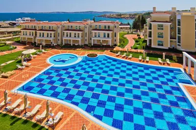 an overhead view of a large swimming pool in a resort at FLORES GARDEN SEA VIEW APARTMENT WITH BALCONY in Chernomorets