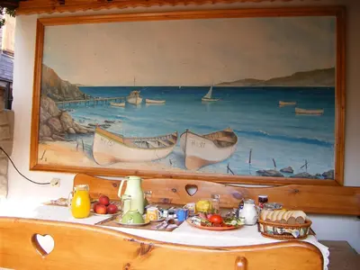 a painting of a painting of boats on a wall at Dari Guest Rooms Стаи за гости Дари in Nesebar