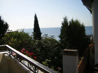 a view of the ocean from the balcony of a house at Dari Guest Rooms Стаи за гости Дари in Nesebar