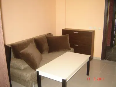 a living room with a couch and a table at Laguna Beach Hotel in Ravda