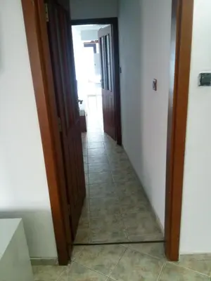 a hallway with a mirror in a room at Rony Hotel in Nesebar