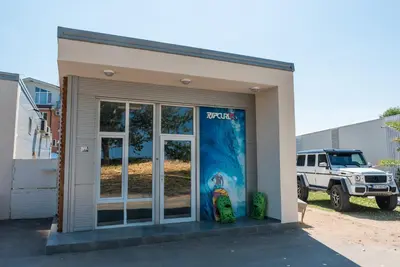 a building with a skateboard parked in front of it at Camping Gradina in Sozopol
