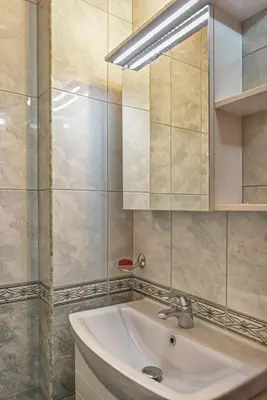 a bathroom with a sink and a mirror at South Beach Vacation Apartments in Sunny Beach