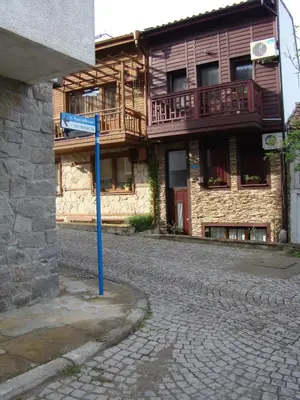 a blue street sign in front of a building at Deep Blue Guest House in Sozopol