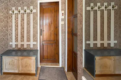 an entrance to a room with a wooden door at Family Hotel Argo in Varna City