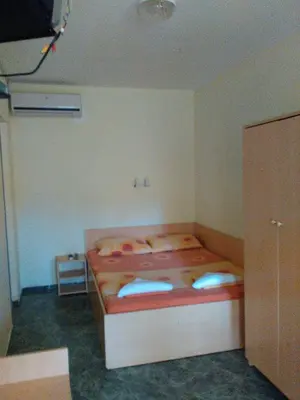 a small bedroom with two beds in a room at Nimpha Bungalows in Kamchia