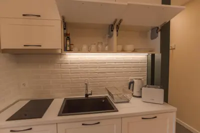 a kitchen with a sink and a counter top at B&P studios in Varna City