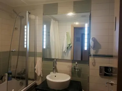 a bathroom with a sink and a shower at Emerald Beach Resort & Spa,studio ikat310 in Ravda