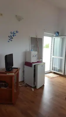 a room with a computer and a desk with a television at Beautiful Penthouse Apartment in Sunny Beach