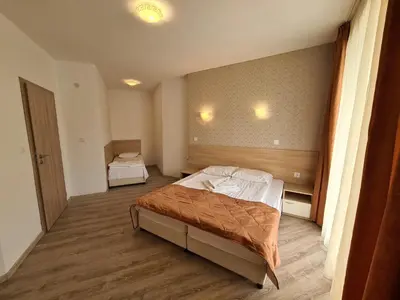 a bedroom with two beds in a room at MIDA Apartment in Obzor