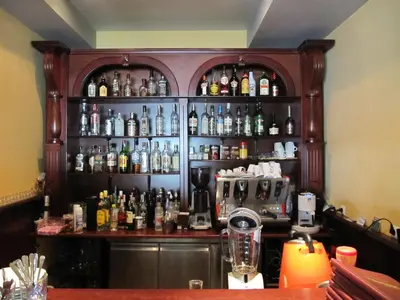 a bar with a lot of bottles of alcohol at Maverick Hotel in Sunny Beach