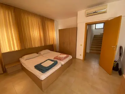 a bedroom with a bed in a room at Beautiful Sun Village with sea view in Byala
