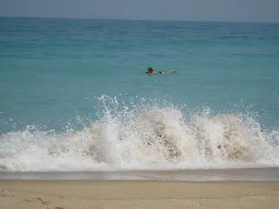 a person swimming in the ocean in the water at Sun Village Villa 13 in Byala