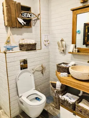 a bathroom with a toilet and a sink at Arapya Beach Apartment in Tsarevo