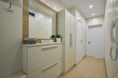 a bathroom with a walk in shower and aabinet at RELAX CENTER Burgas & Free PARKING in Burgas City