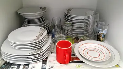 a group of plates and cups sitting on a table at Family Apartment - COMFORT IN THE CENTER in Burgas City