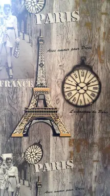 a picture of the eiffel tower and a clock at Family Apartment - COMFORT IN THE CENTER in Burgas City