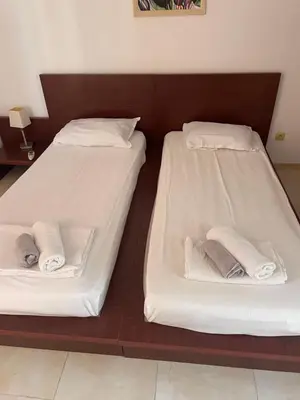 two beds sitting next to each other in a room at Sun Village Villa 6 in Byala