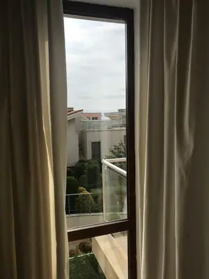 a window with a view of a building at Sun Village Villa 6 in Byala