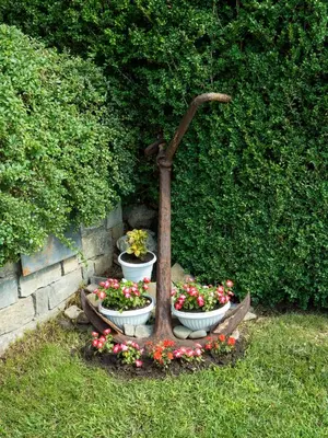 two pots of flowers sitting in a garden at Milennia Family Hotel in Sunny Beach