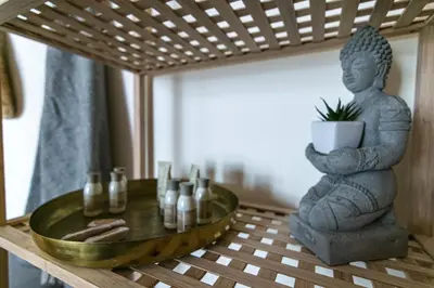 a meditation room with a statue and a table at The Monkee Studios in Sveti Vlas