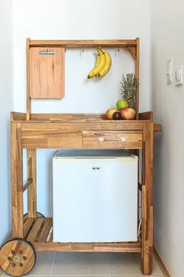 a wooden stand with a banana and fruit on it at The Monkee Studios in Sveti Vlas