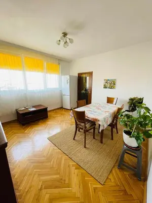 a living room with a table and chairs and a room with a table at Sunny Cozy Flat in the Centre, close to beach, 4 rooms, 105sqm in Varna City