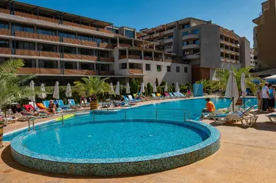 a swimming pool in front of a hotel at Grenada - Menada Apartments in Sunny Beach