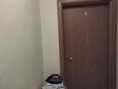 a wooden door in a room next to a toilet at Фамилна къща Джоко in Kiten