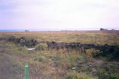 a field with a fence in the grass at Apartment Rutland Beach in Ravda