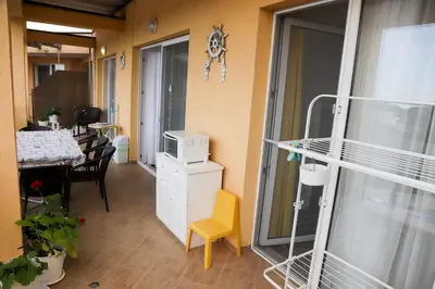 a room with a bed and a table and a dining room at Lux Sozopoli Hills Apartments A19 и Studio А13 in Sozopol