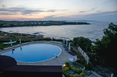 an aerial view of a swimming pool next to the water at Sunset Vibes in Arapya - Breathtaking Views and Pool - by Flаt Manаger in Arapya