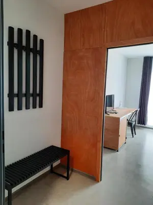 a room with a bench and a desk and a mirror at VIDA in Lozenets