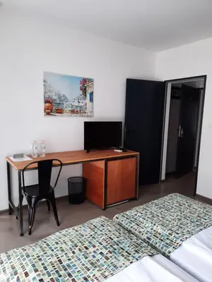 a room with a desk with a chair and a bed at VIDA in Lozenets