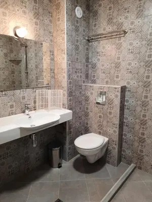a bathroom with a toilet and a sink at VIDA in Lozenets