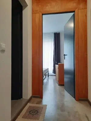 an open door to a room with a hallway at VIDA in Lozenets